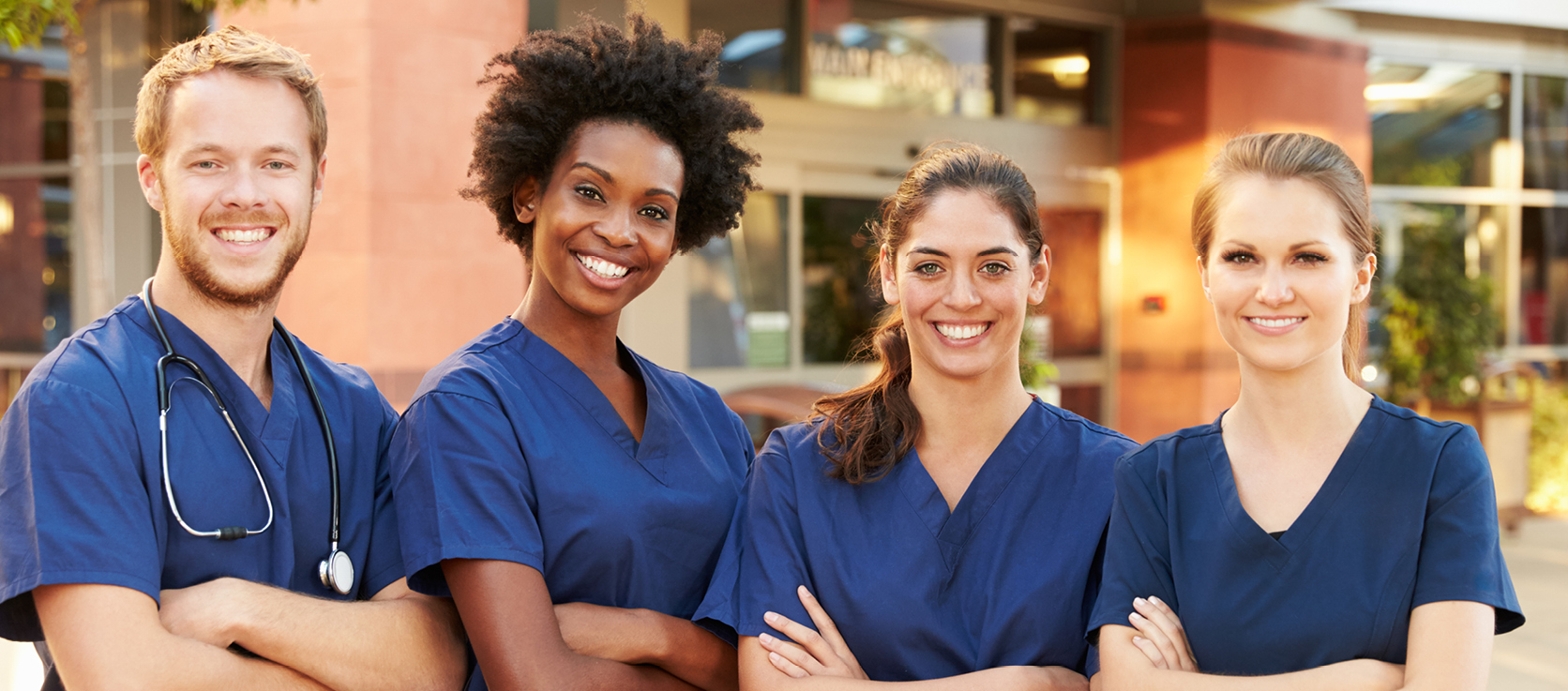 Diverse group of male and female nurses standing and smiling