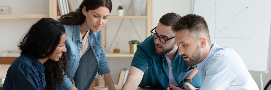 A group of people collaborating on a project in an office.