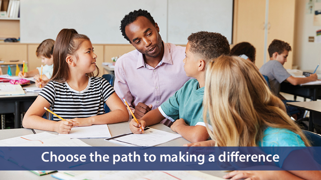 Male teacher helping three young students ina classroom with their worlk. With an image banner, Choose the path to making a difference