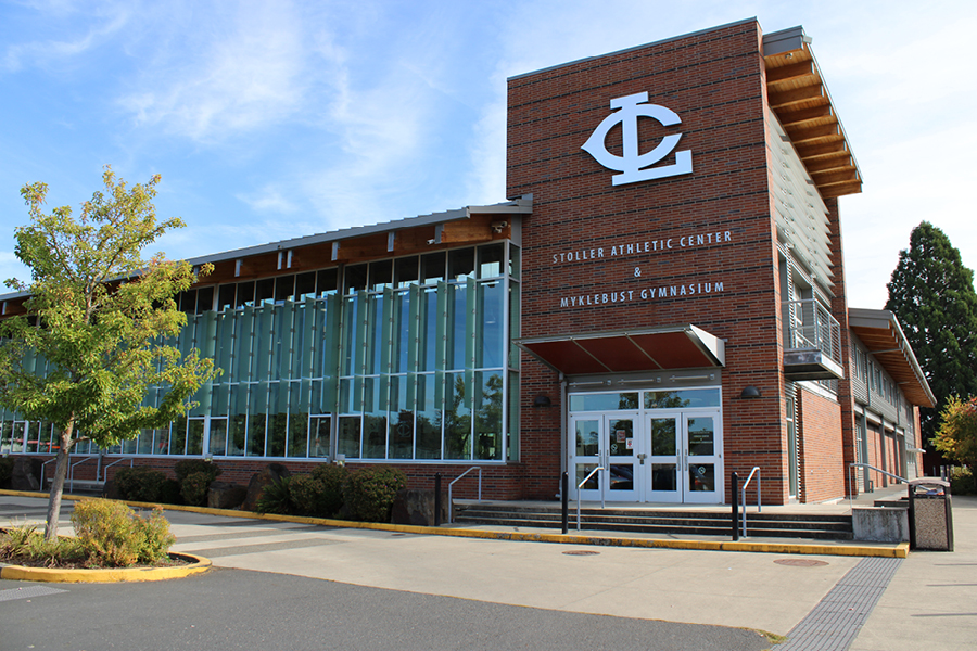 Gym & Fitness Center Exterior view of the Stoller Athletic Center and Myklebust Gymnasium, featuring large glass windows and a modern brick facade.