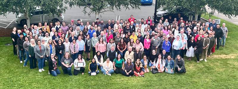 2025 LCC Reception photo of faculty, staff, and retirees from the second floor arial view of the RCA. 