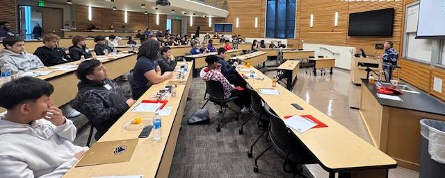 Brothers in power conference with 11th and 12th grade students in a LCC conference hall listening to a speaker.