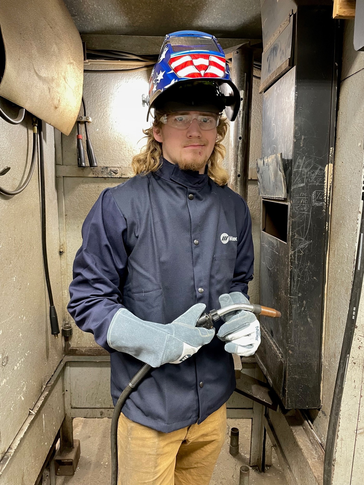 Welding student in protective gear
