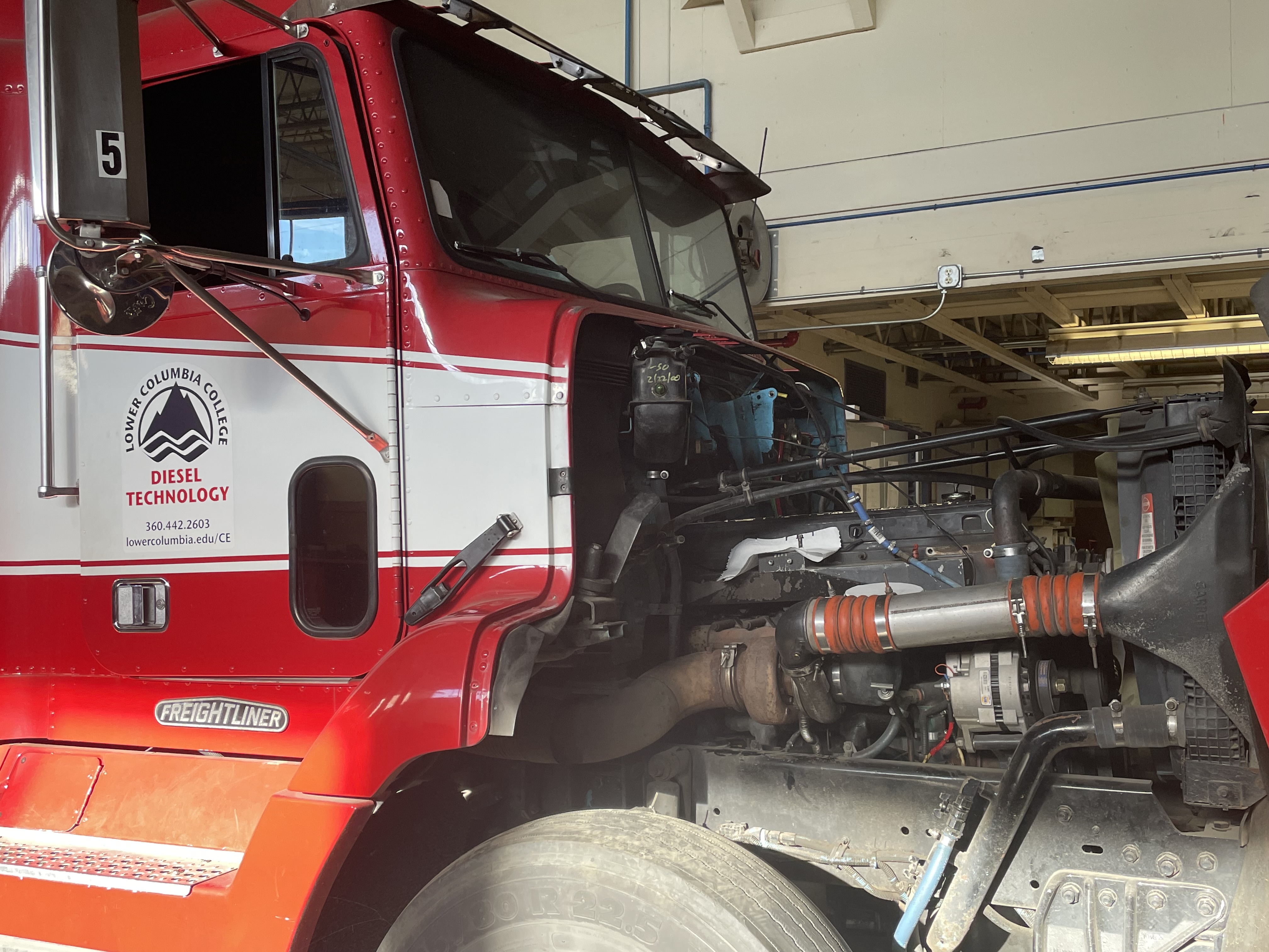 Image of a truck with it's hood detached