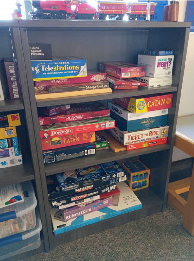 Shelves filled with various board games
