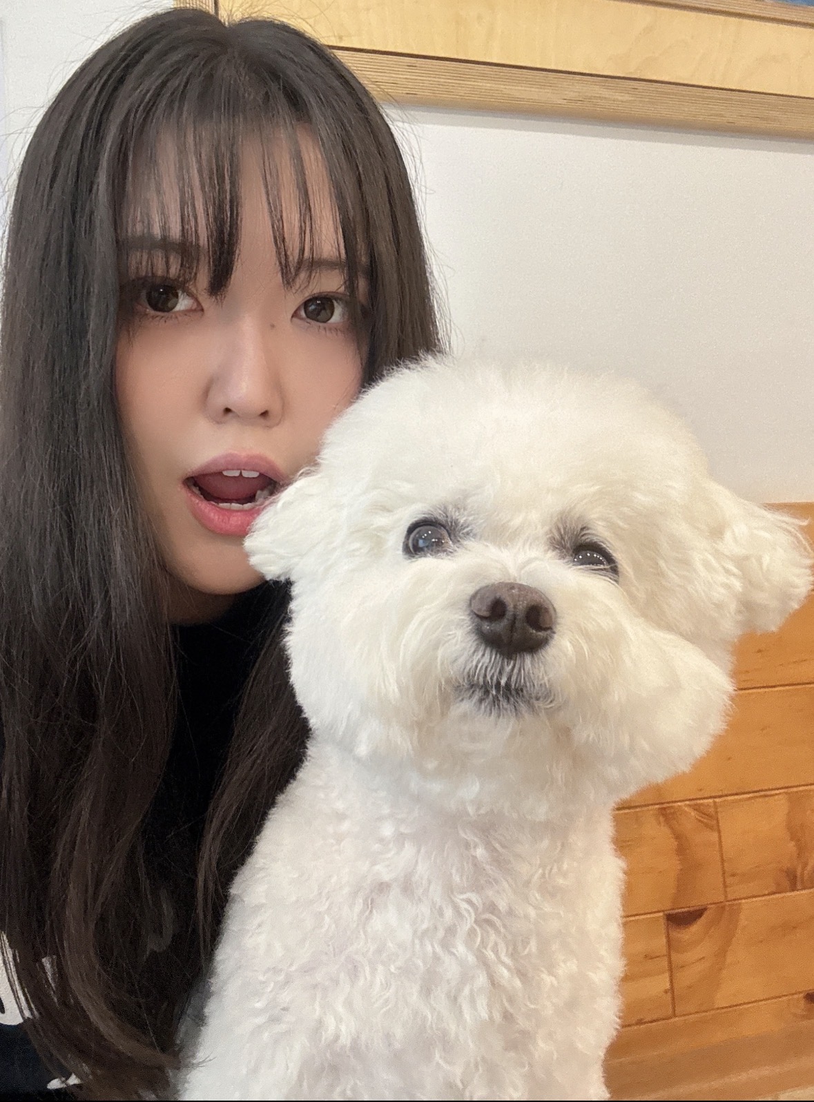 Female International Student selfie with a small white dog