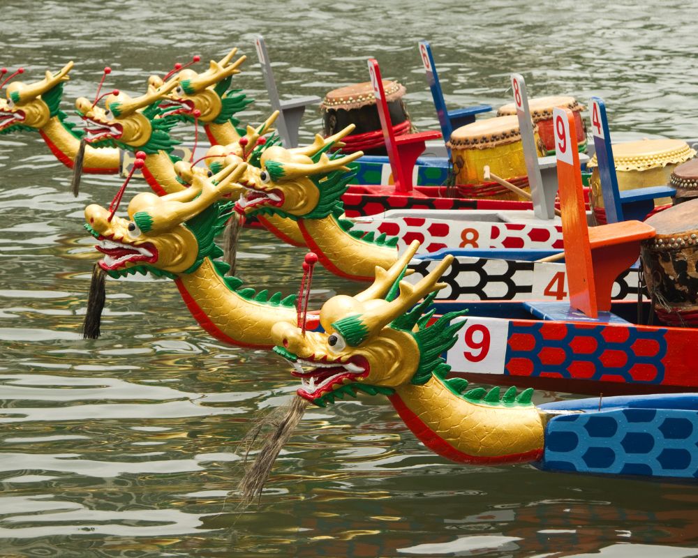 traditional decorative racing boats ont he river