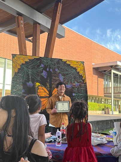 International student receiving and award on multicultural night
