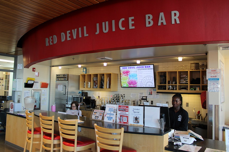 Red Devil Juice Bar with with work study students sitting at the counter ready to serve students