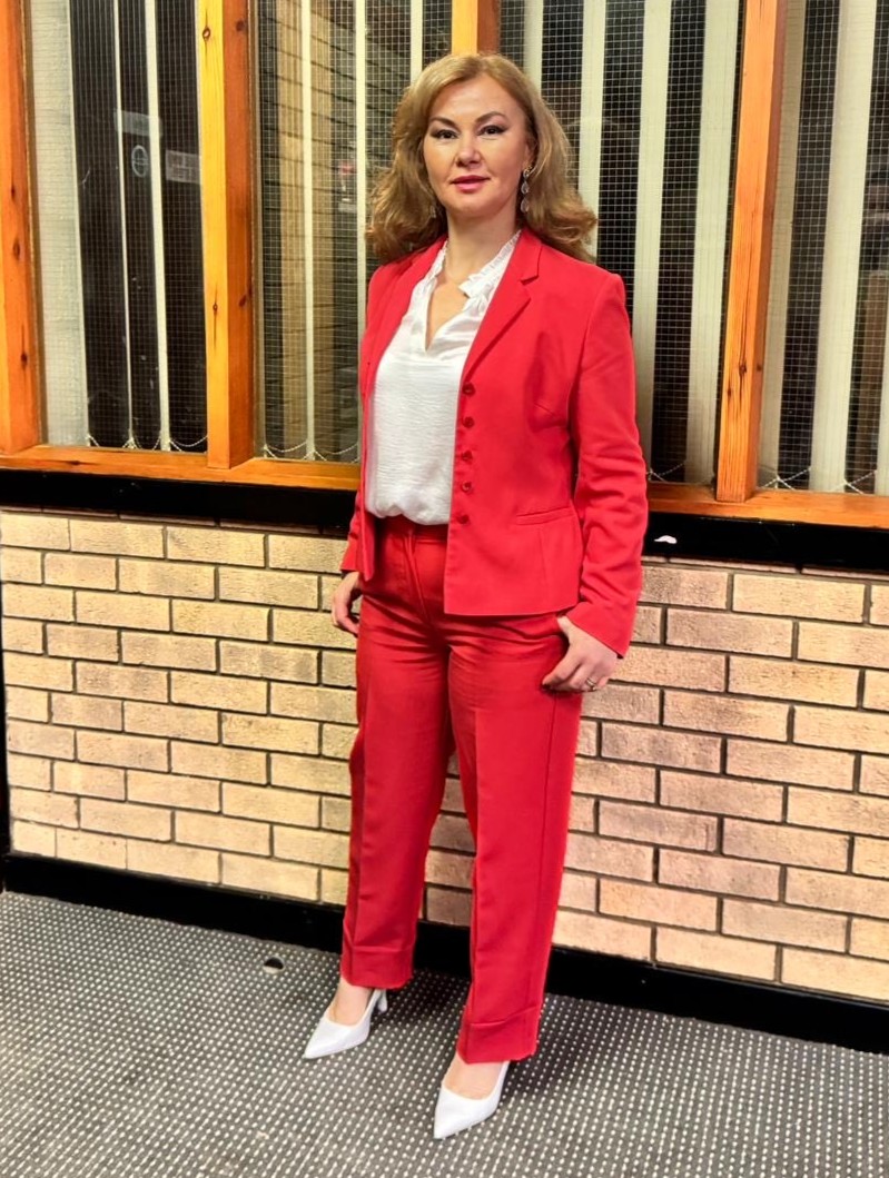 Nicoleta in a red suit.