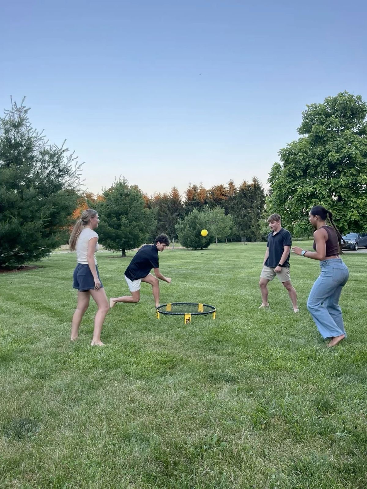 Students playing spikeball.