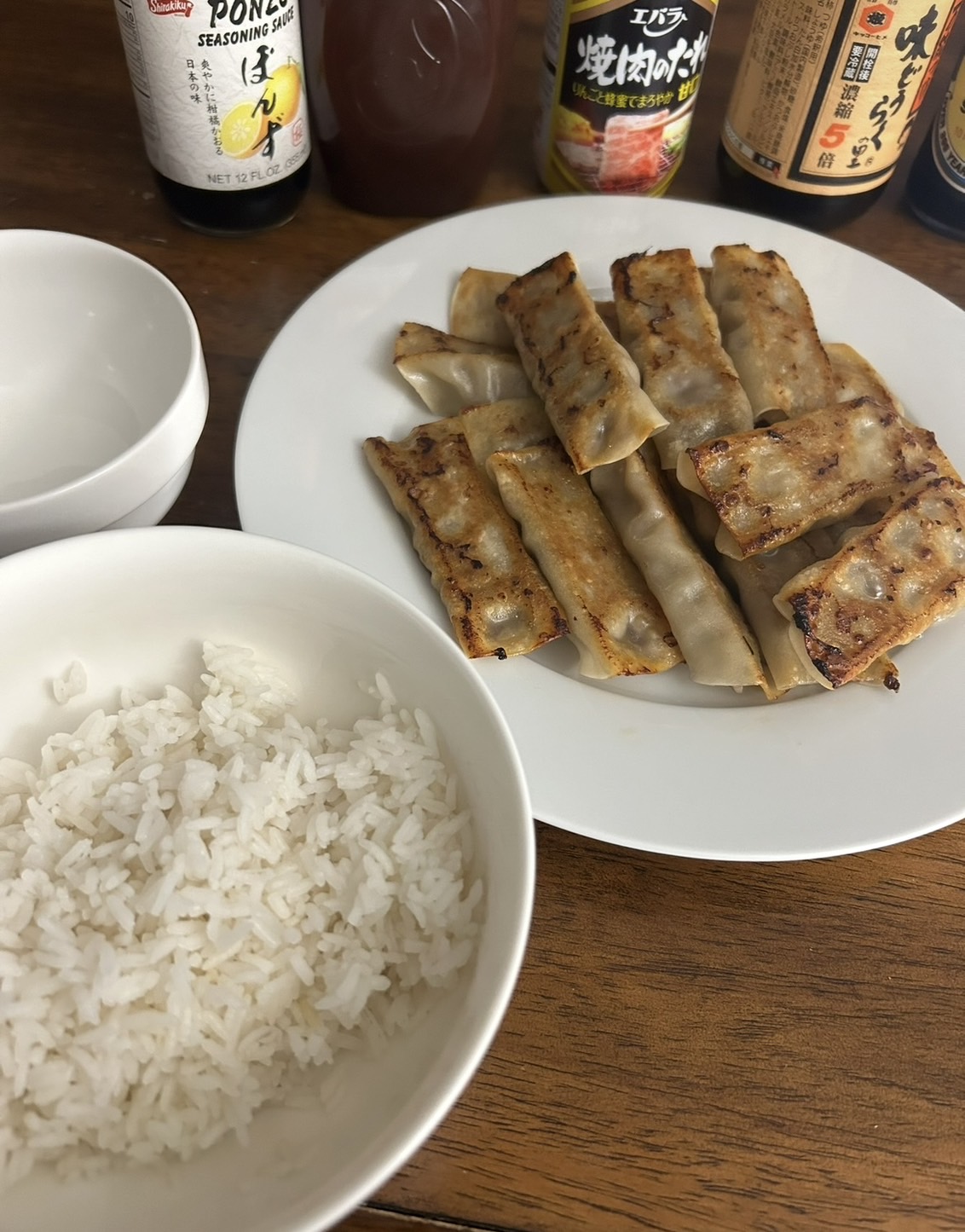 Yuikas meal with rice and sauces on a table.