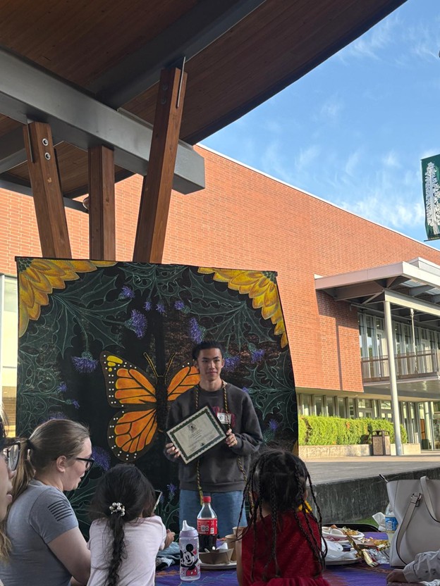 International student receiving and award on multicultural night