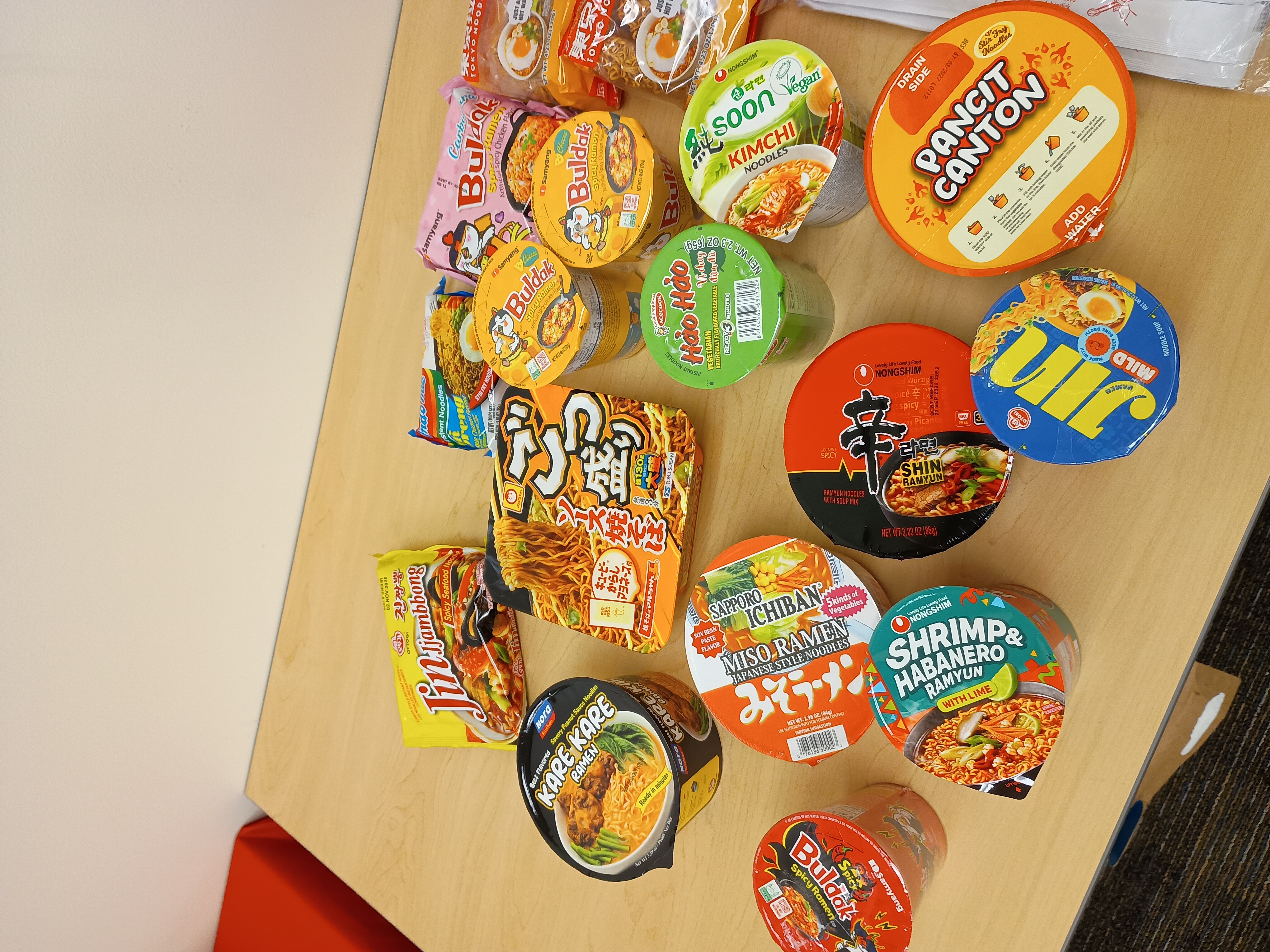 assorted ramen flavors and brands spread across a table