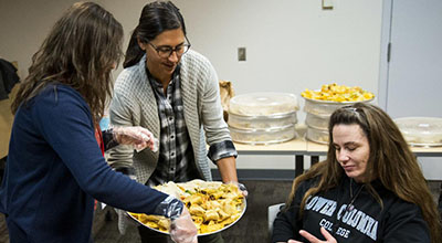 Lower Columbia College students, staff and faculty gather for a luncheon intended to simulate the American class system and poverty.