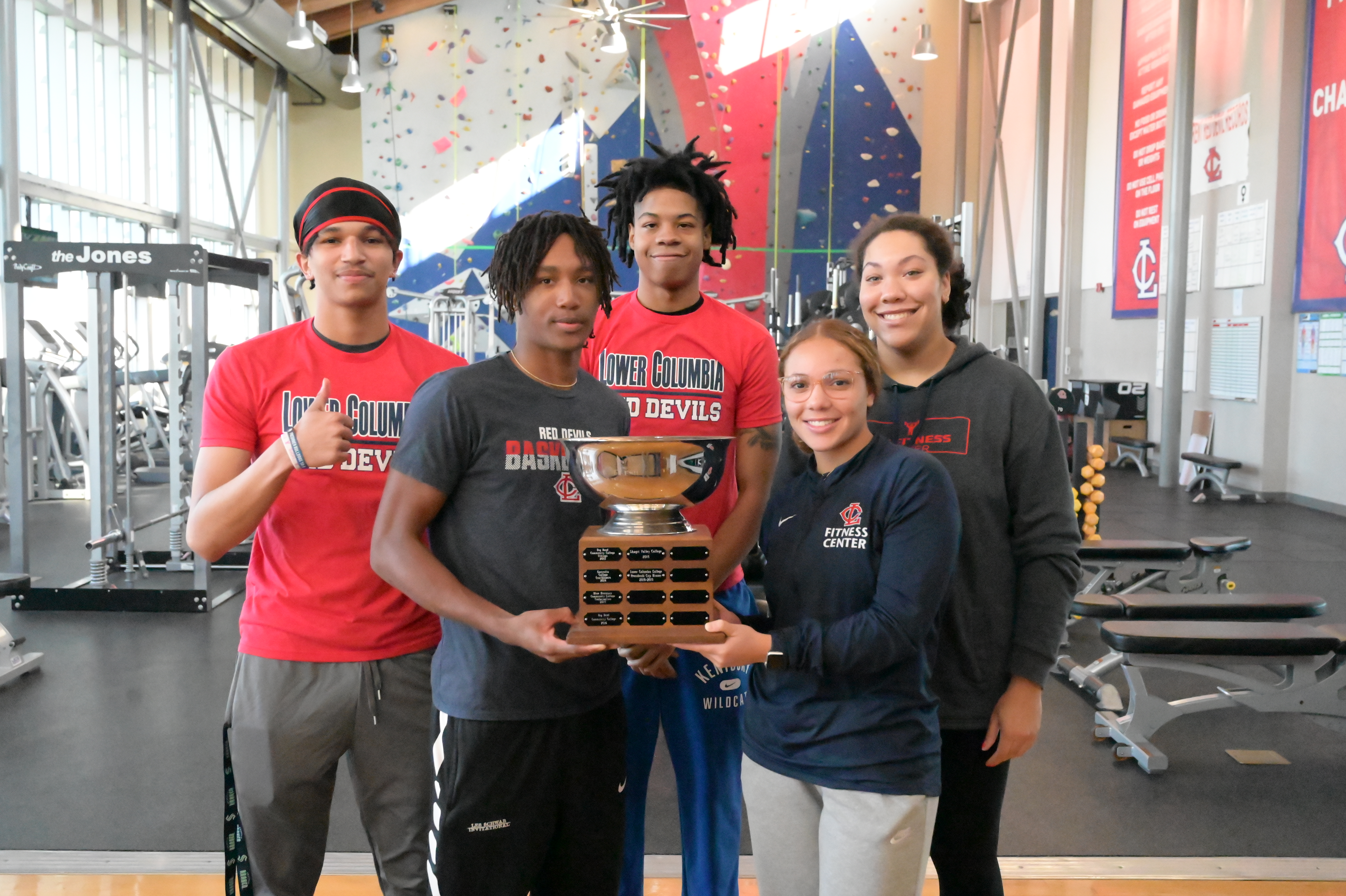 From left to right, David Young, Keshawn Lewis, Amir Locus, Maliyah Twitty and Kate Johnson show off the 2019 Presidents Cup award.