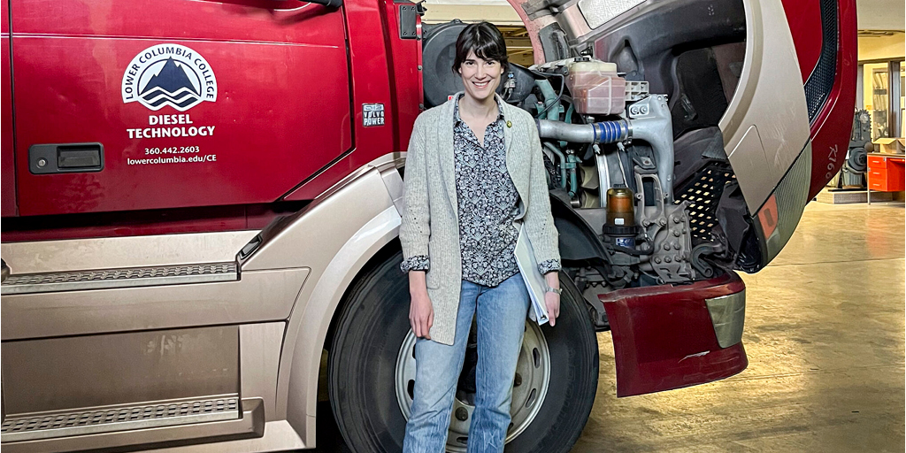 Marie Gluesenkamp Perez standing in front of an LCC Diesel truck