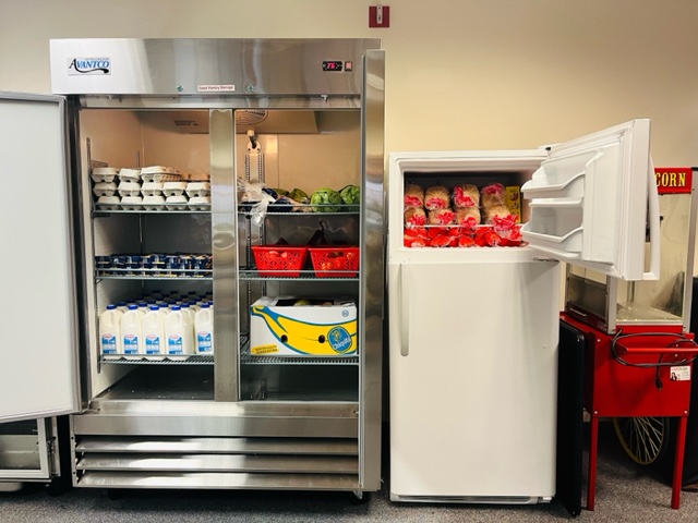 Food pantry refrigerator and freezer filled with food