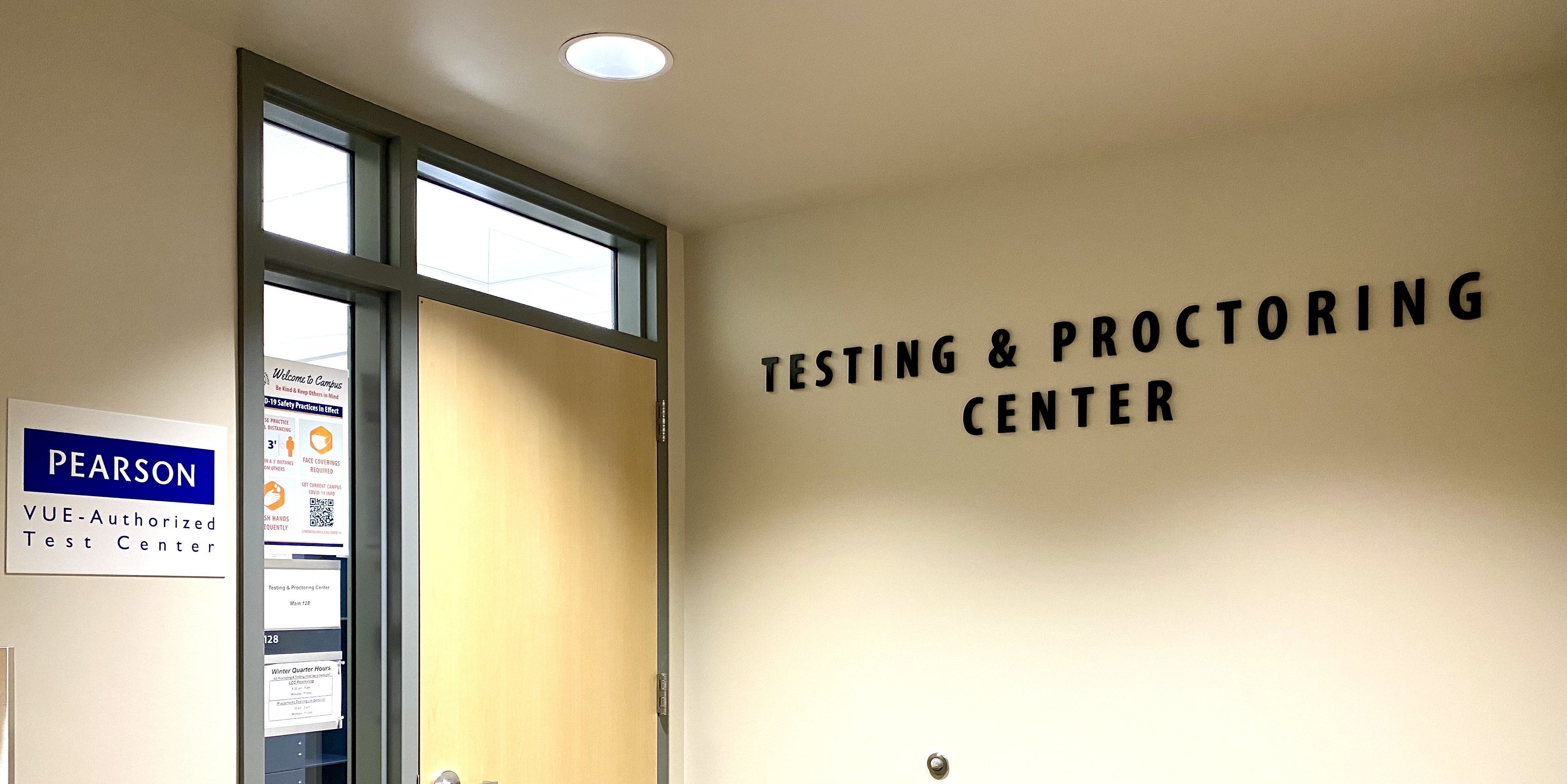 hallway entrance to a classroom with the name Testing Center above the doorwar