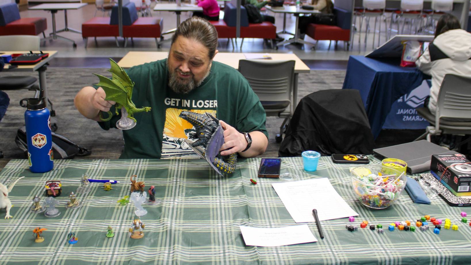 Dungeons and Dragons Club member showing off the game characters at the LCC Clubs and Orgs Fair