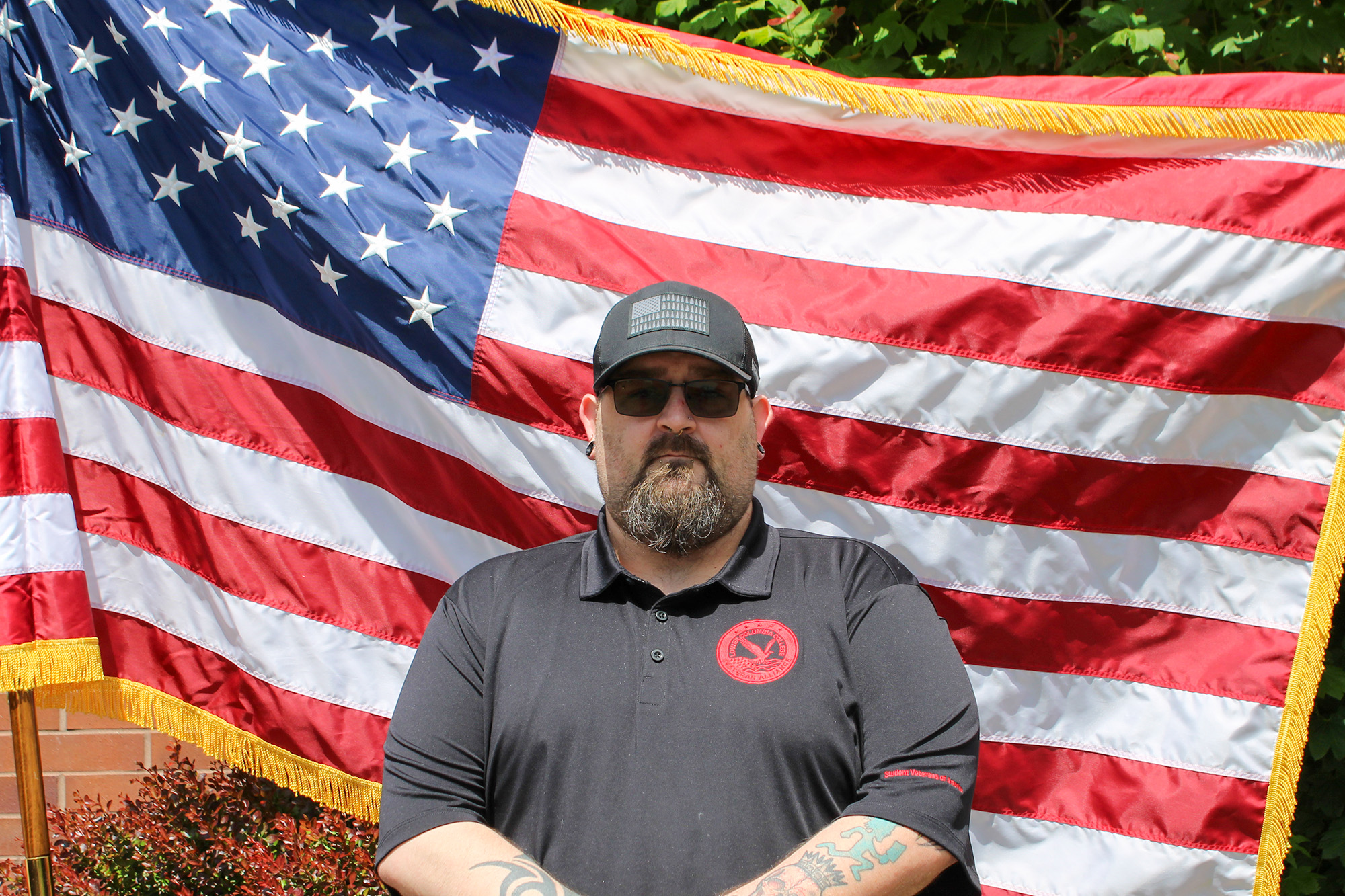 2025-2026 Vice President of the Veterans Alliance Club 2025-2026 Vice President of the Veterans Alliance Club standing in front of the American flag
